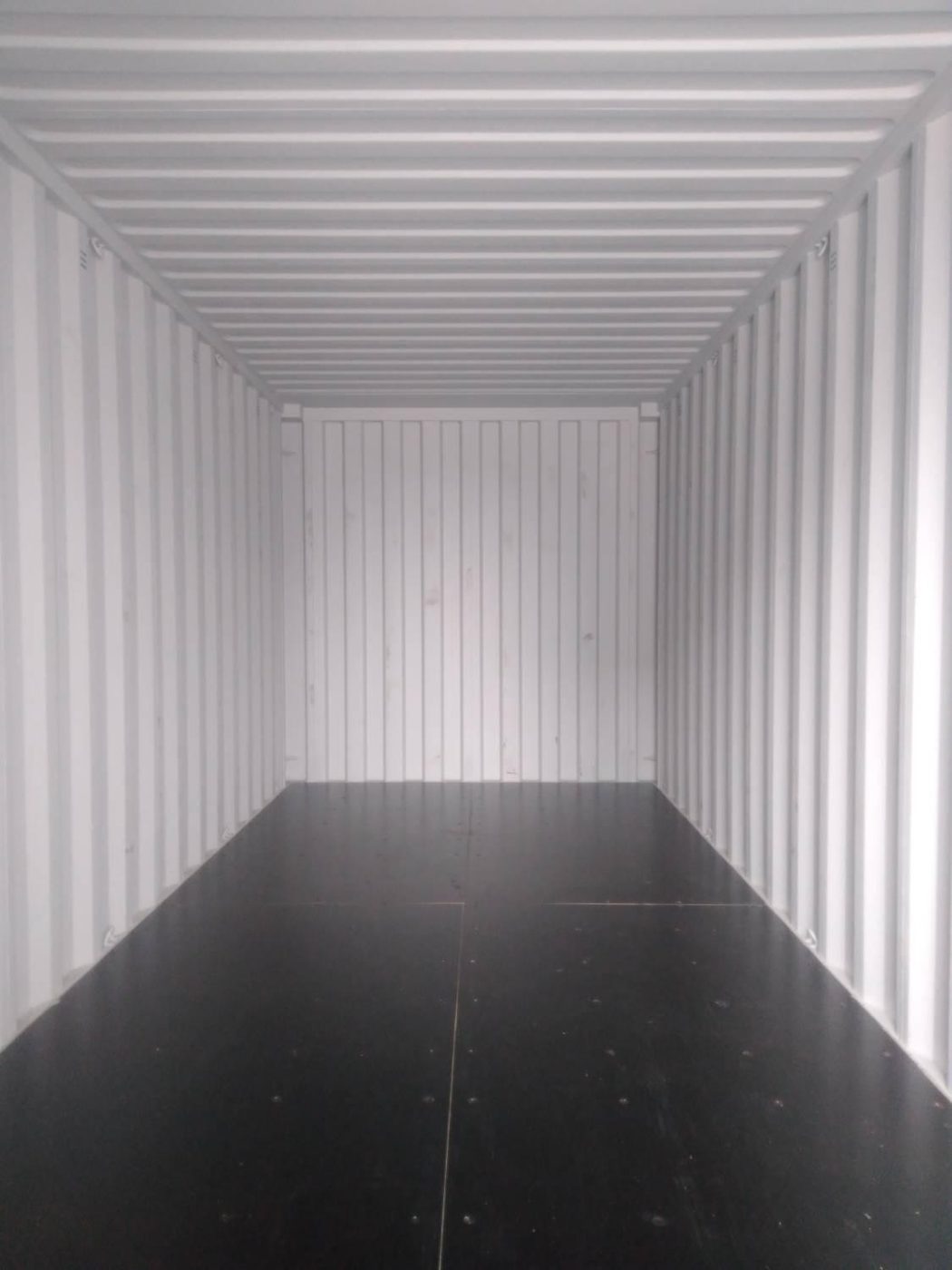 Inside a brand new 20ft shipping container, clean walls and floor
