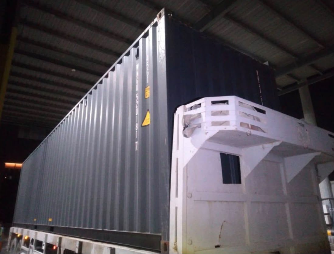 New black 40ft high cube container on a trailer
