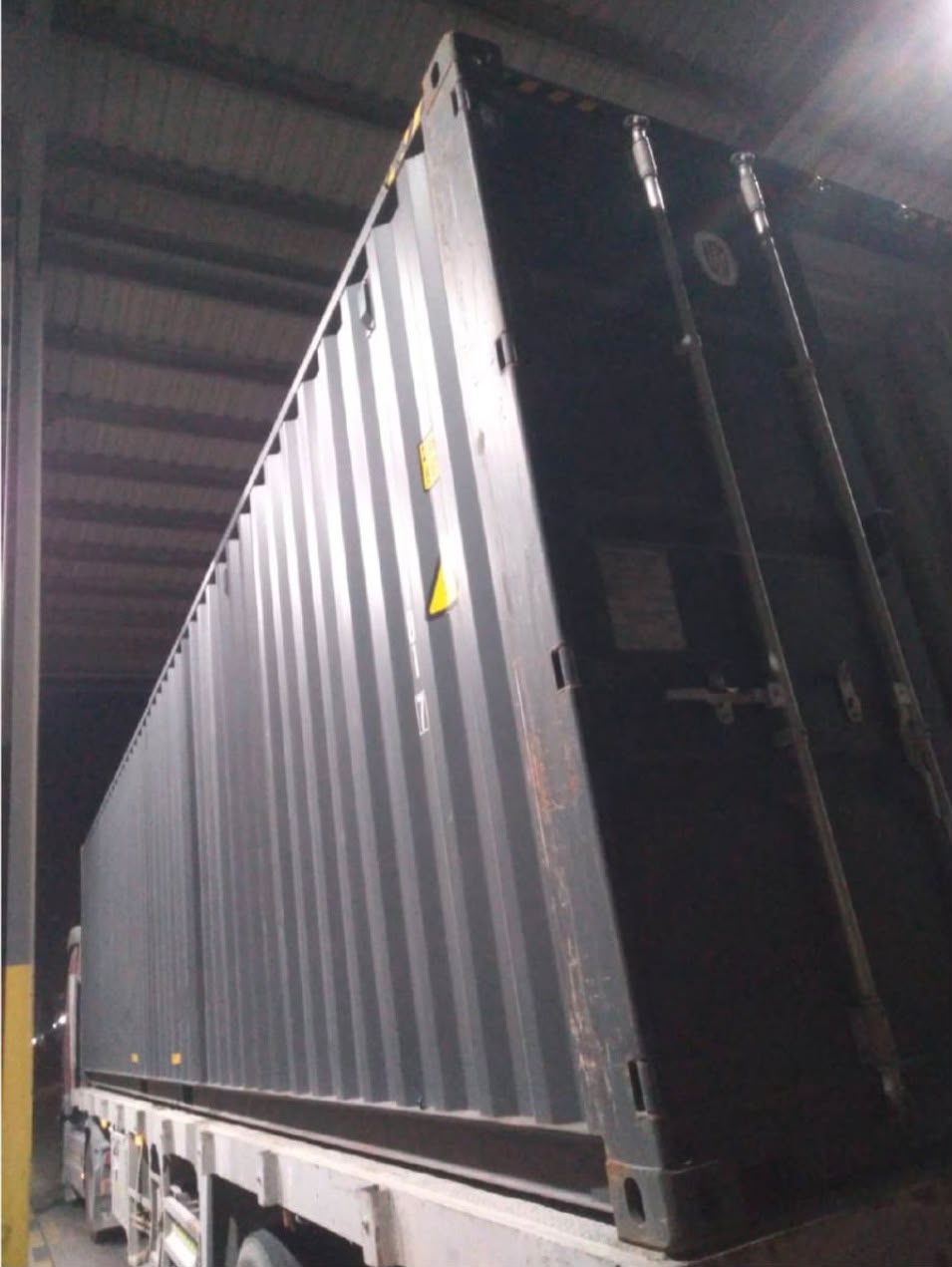 Brand new black 40ft high cube shipping container, side view