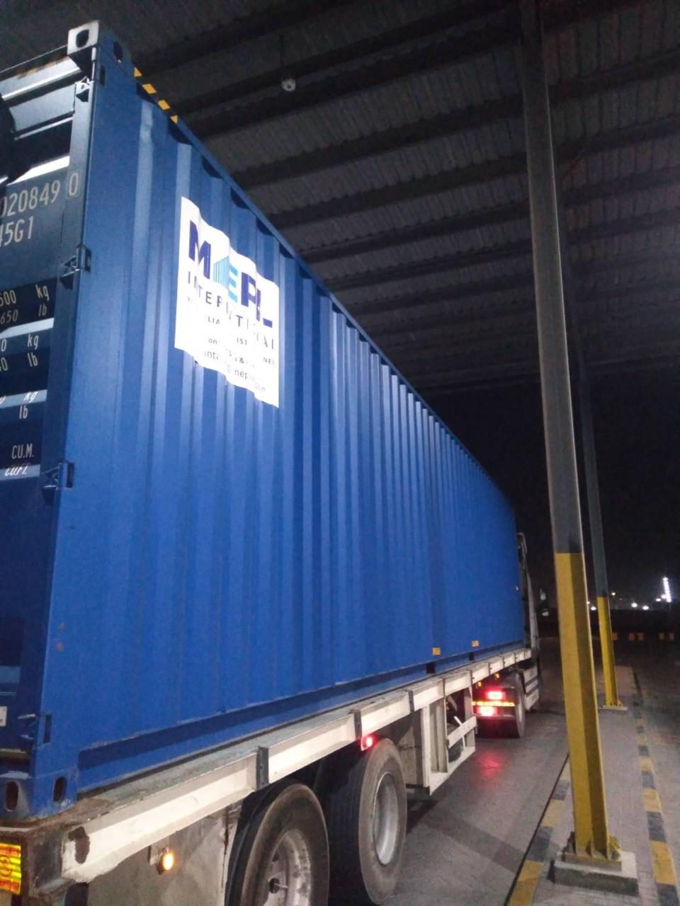 Brand new blue 40ft high cube shipping container, side view